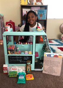 iLEAD Antelope Valley learner with toy truck