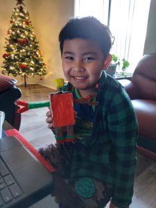 iLEAD Antelope Valley learner holding robot he made