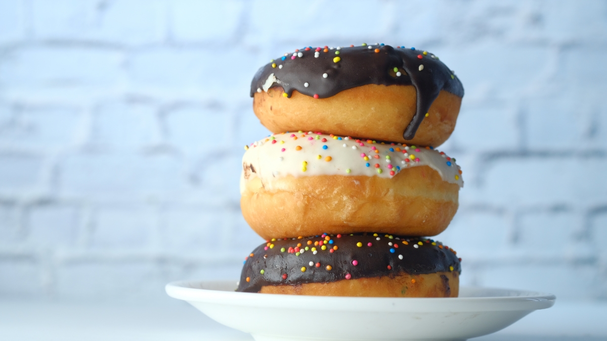 stack of donuts with sprinkles