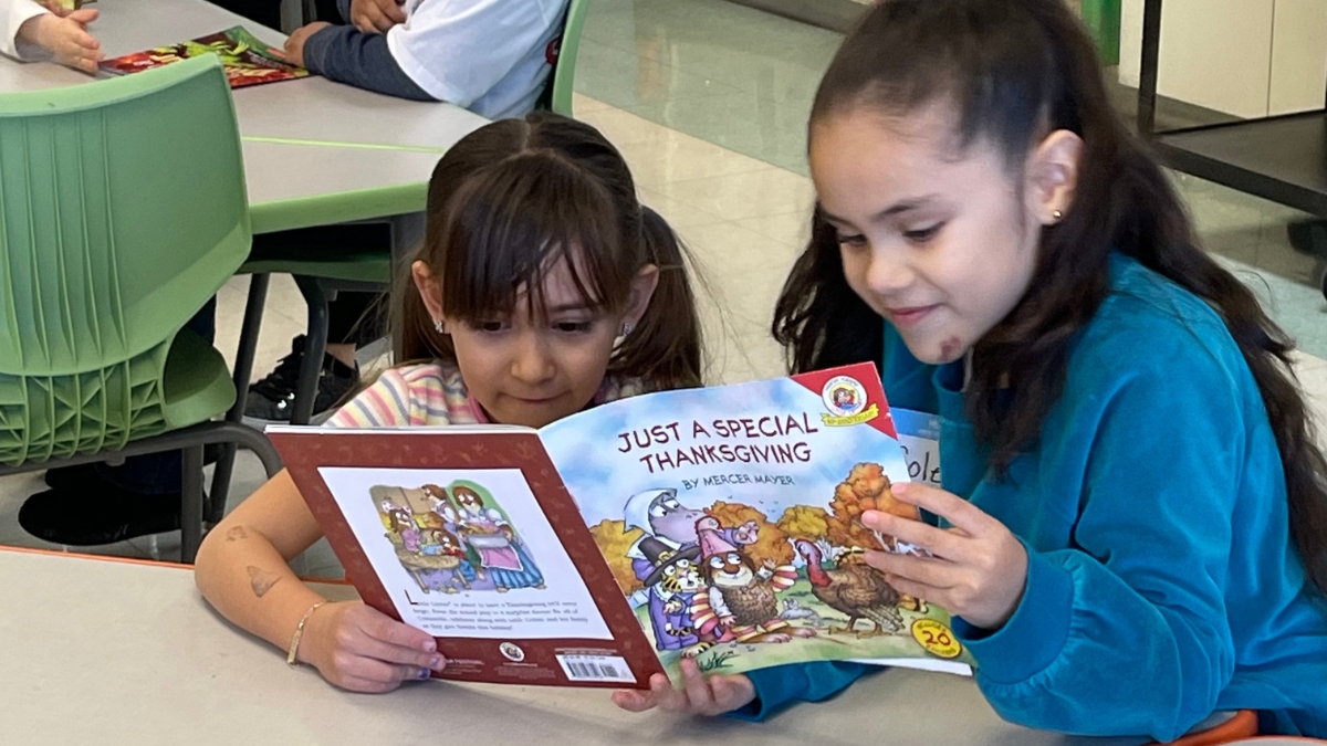 iLEAD AV Exploration learners reading Thanksgiving book 11.7.2024